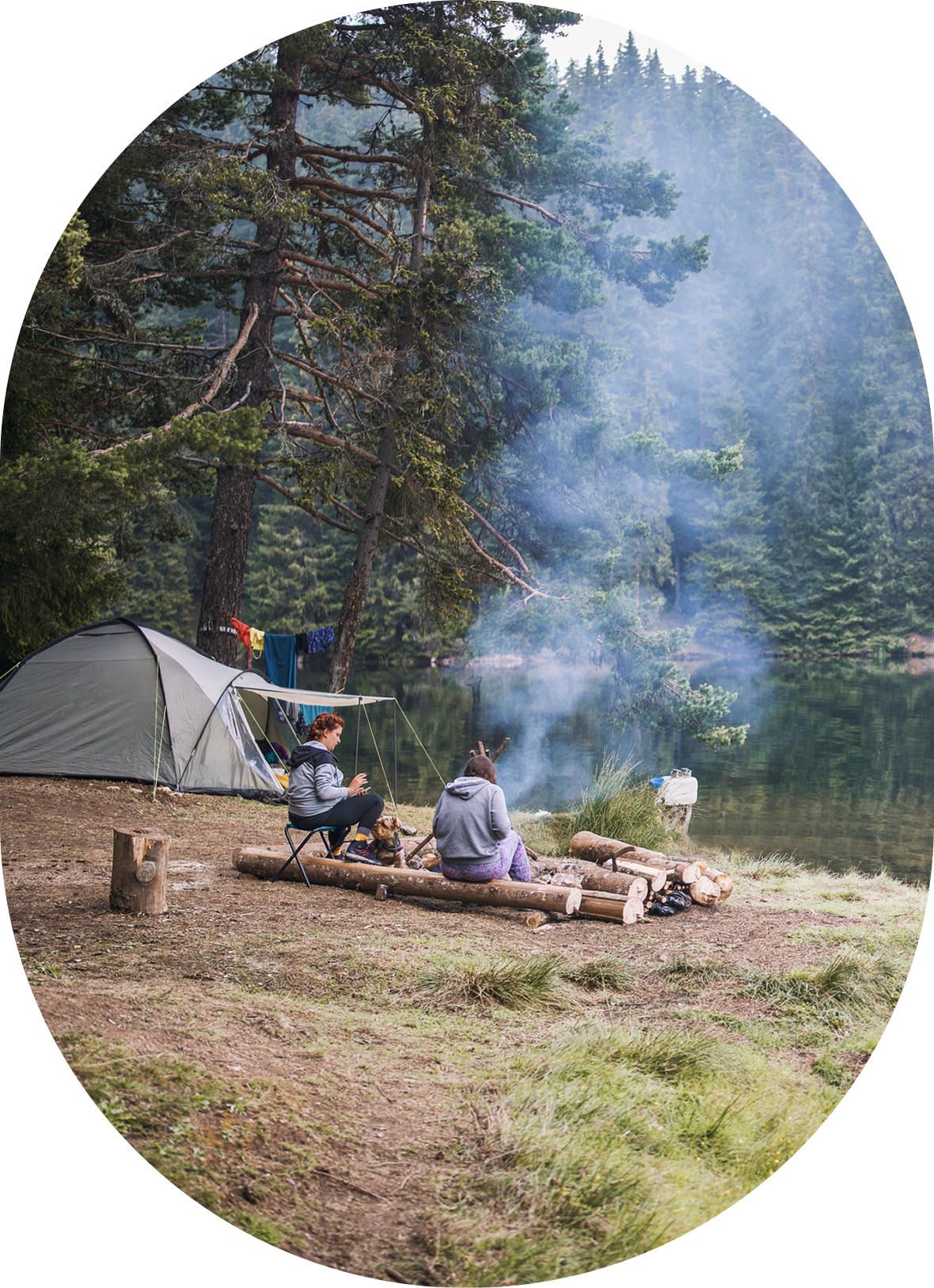 Outdoor camping scene with smoke rising
